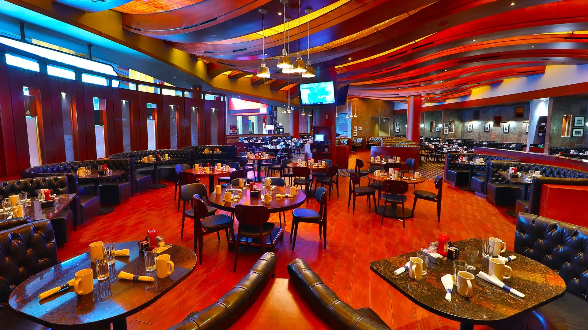 Coastal Craft Kitchen & Bar tables and booths in vibrant color