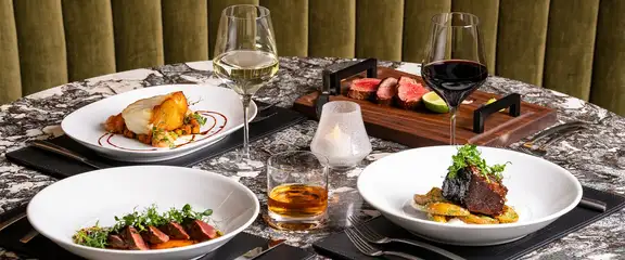 Entrees on table at Gordon Ramsay Steak at Caesars Southern Indiana