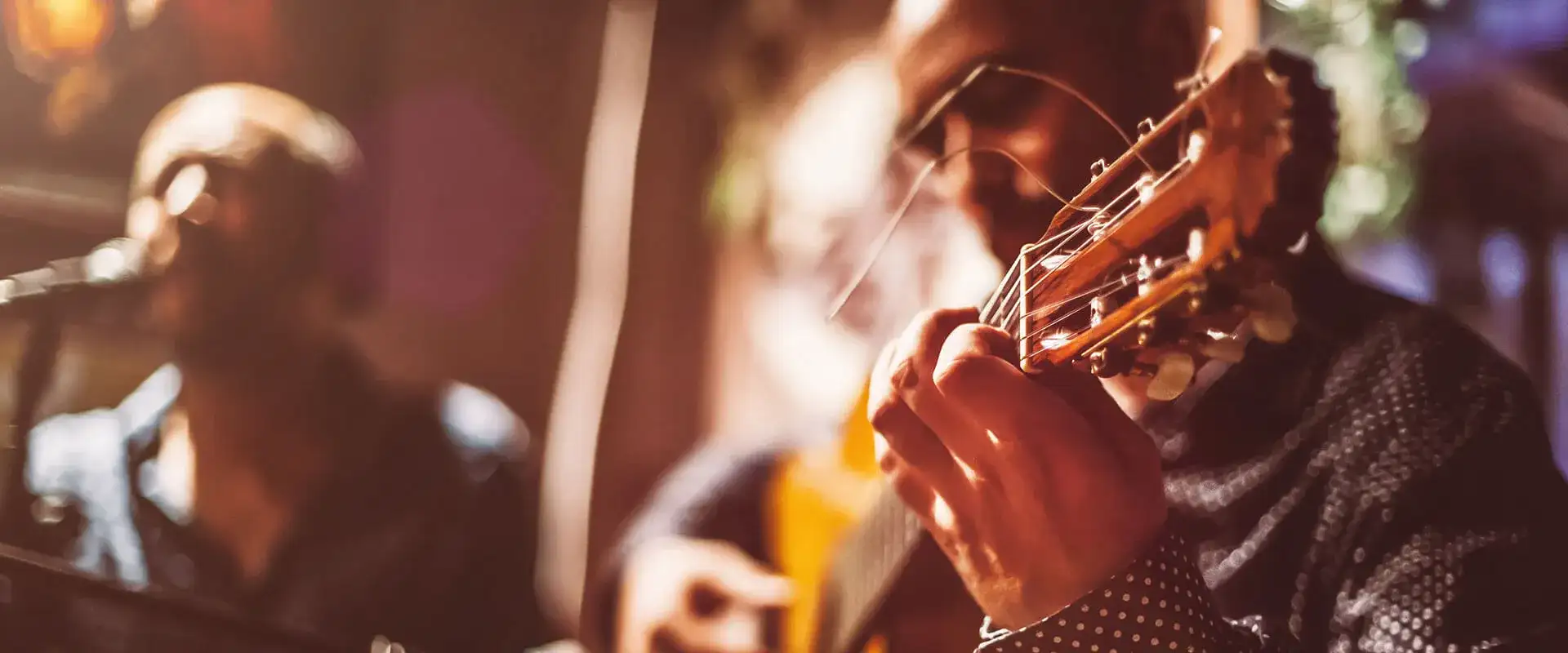 Man playing a guitar.