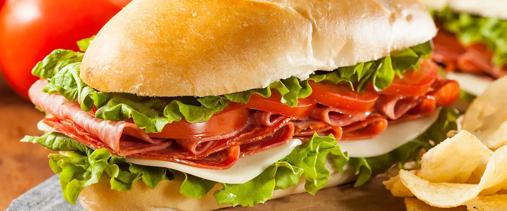 Sub sandwich next to potato chips