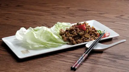 Lettuce wraps on a plate.