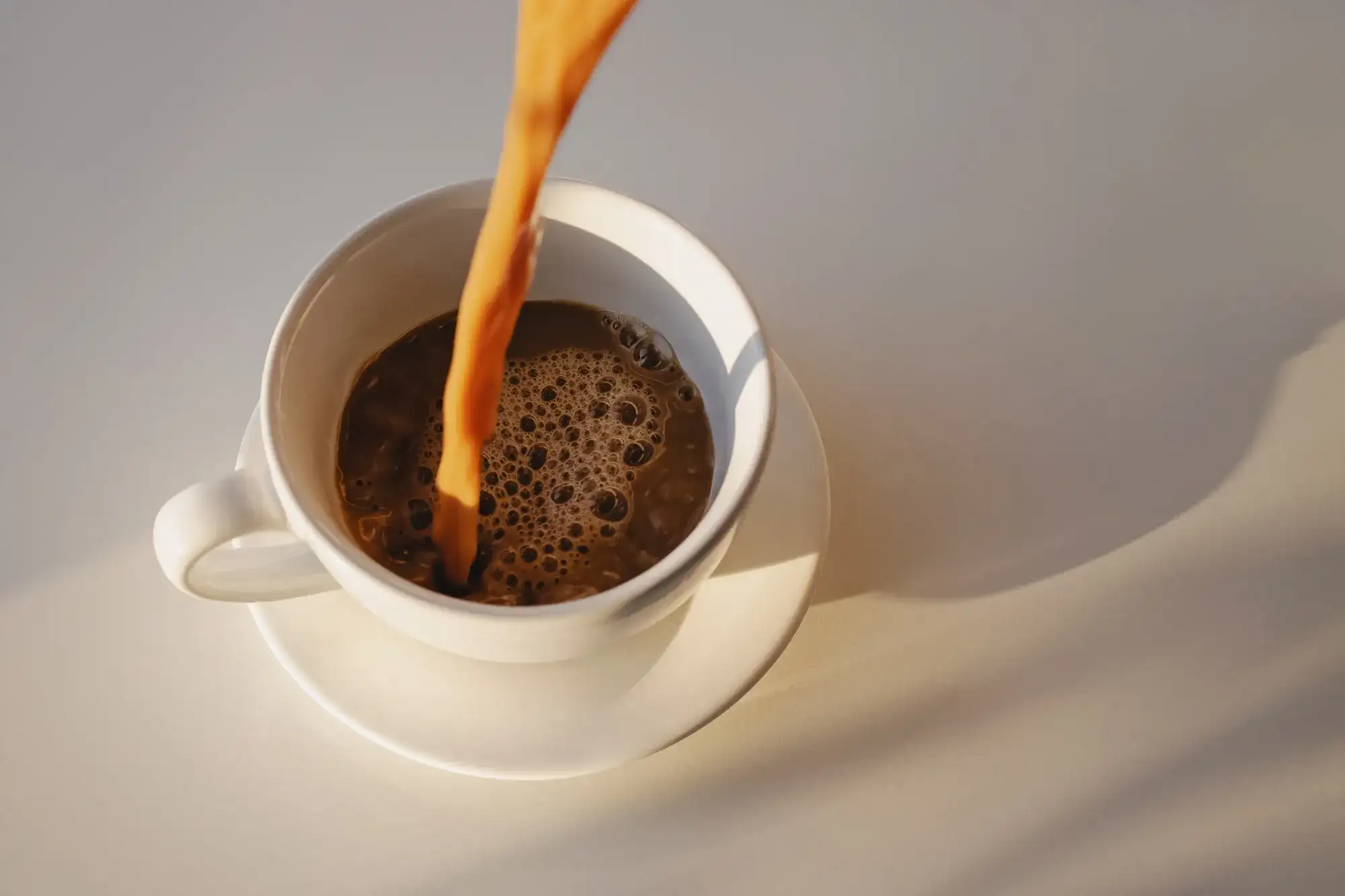 Cup of coffee being poured