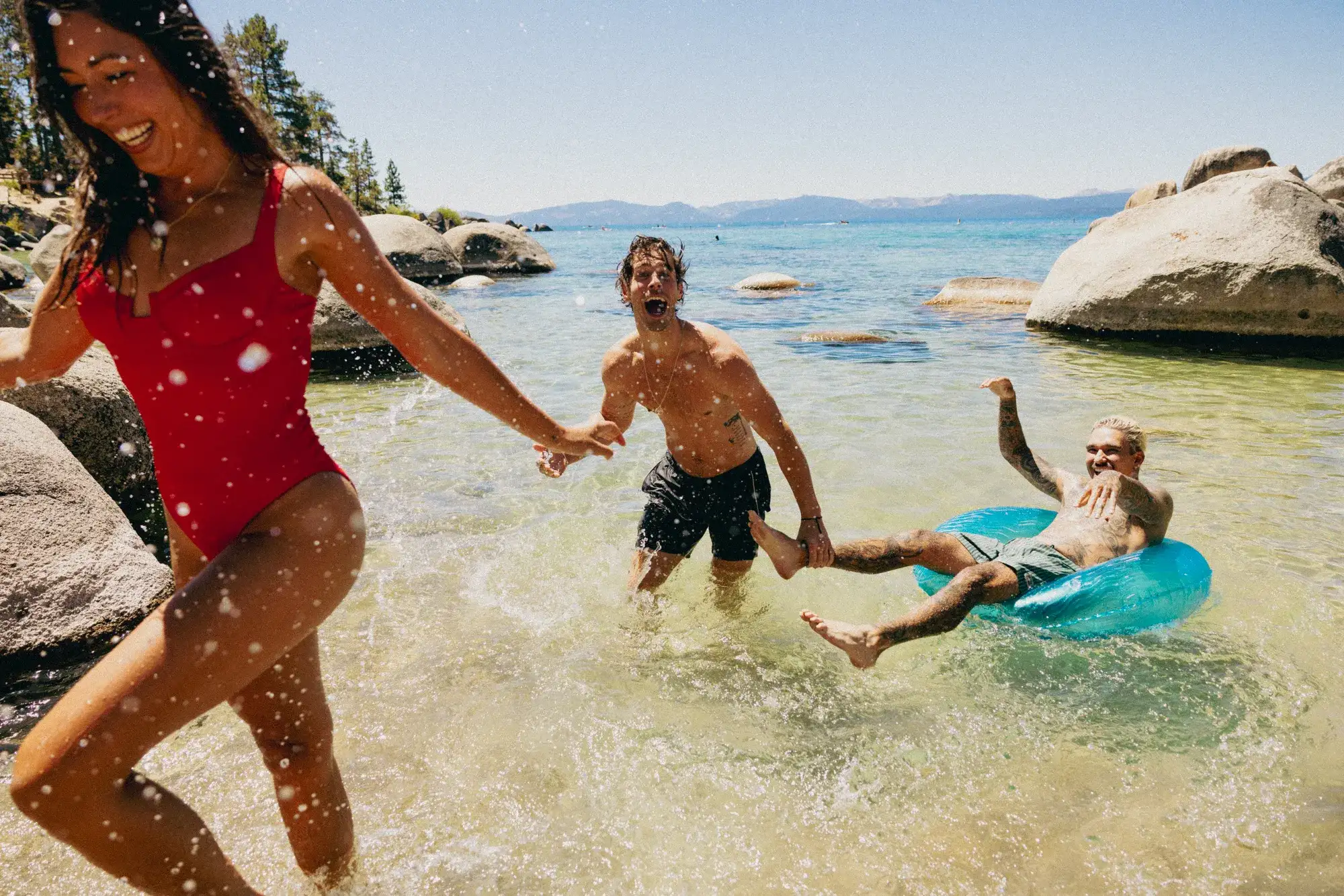 Group enjoying a sunny day at a Lake Tahoe beach near the Stateline resort corridor in South Lake Tahoe.