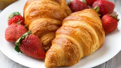Croissant with fresh strawberries.