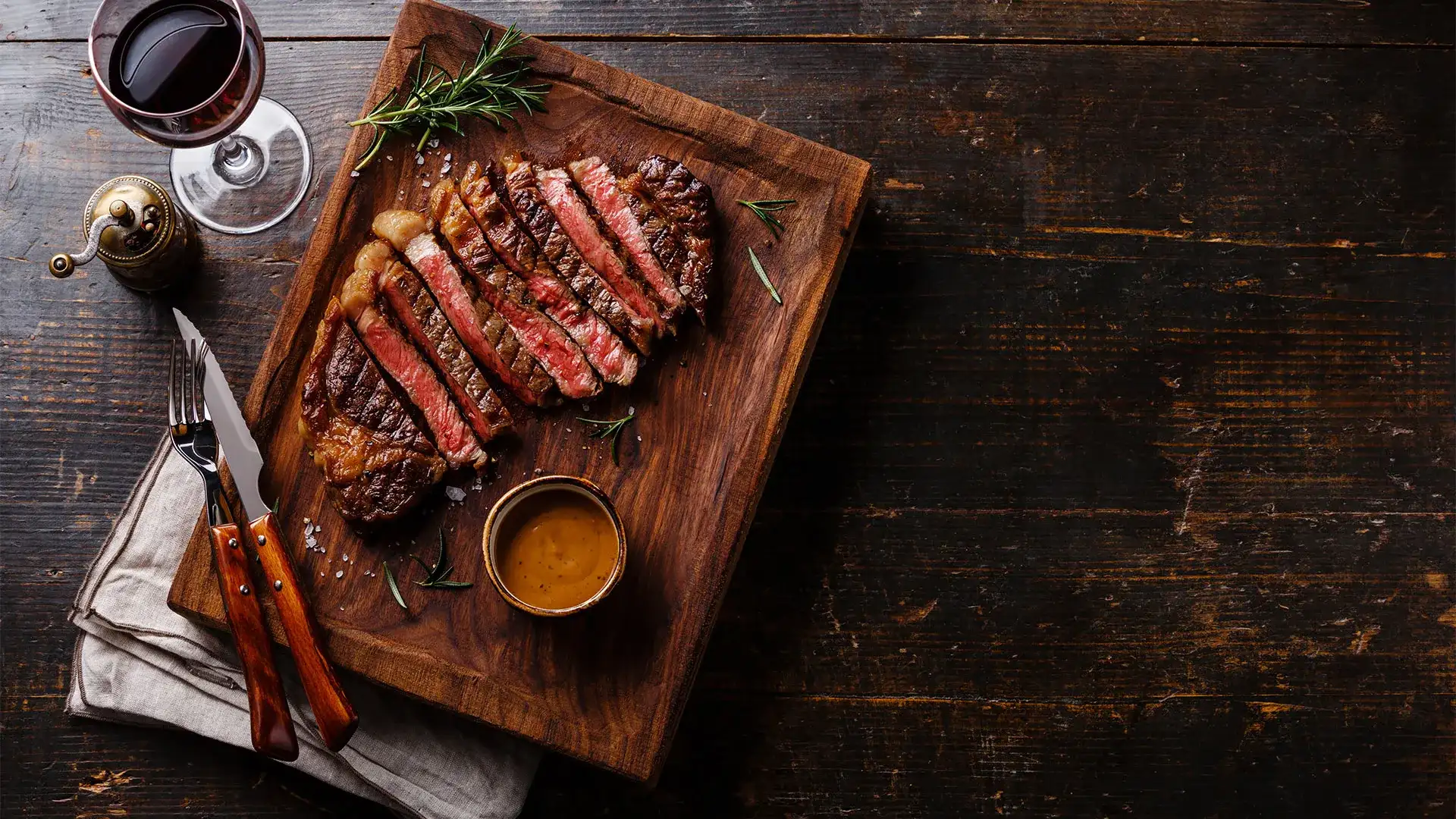 Sliced steak on a cutting board