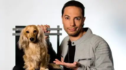 Alex Ramon headshot with dog