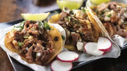 3 street tacos on a platter.