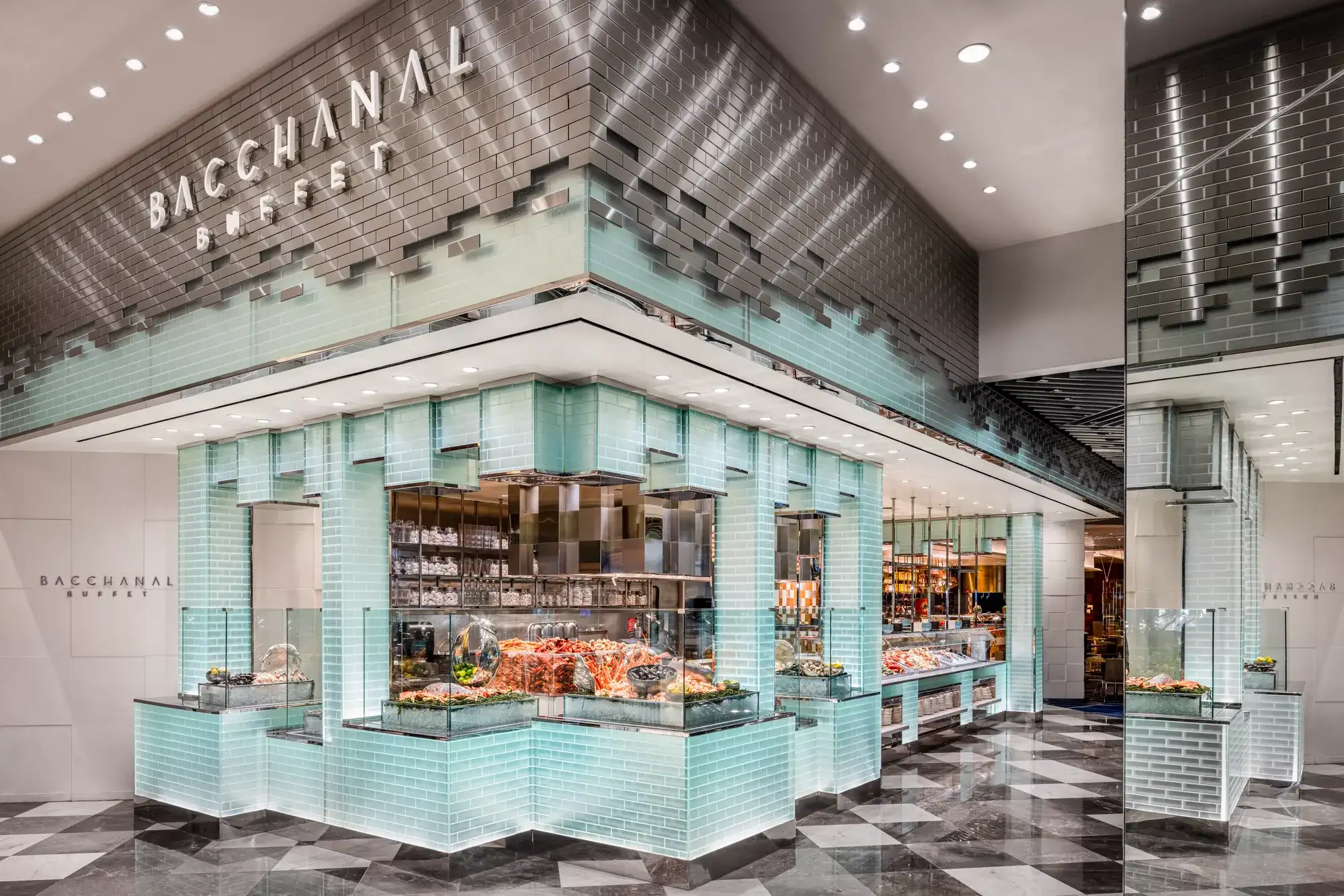 Bacchanal Buffet entrance at Caesars Palace Las Vegas with illuminated signage, glass-tile buffet stations, and seafood displays