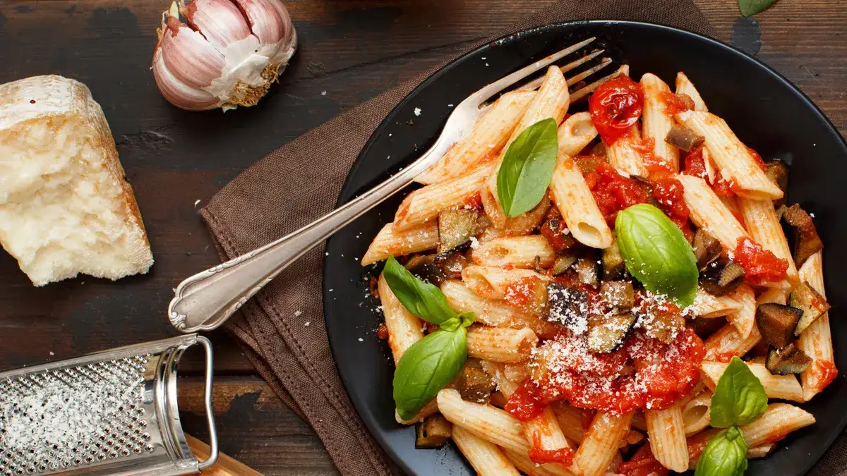 Penne pasta with onion and fresh parmesan