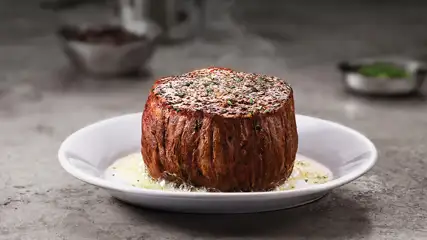 Filet on a plate with melted butter.