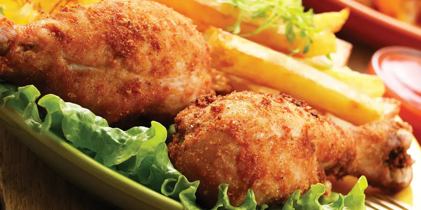 Fried chicken with a side of fries.