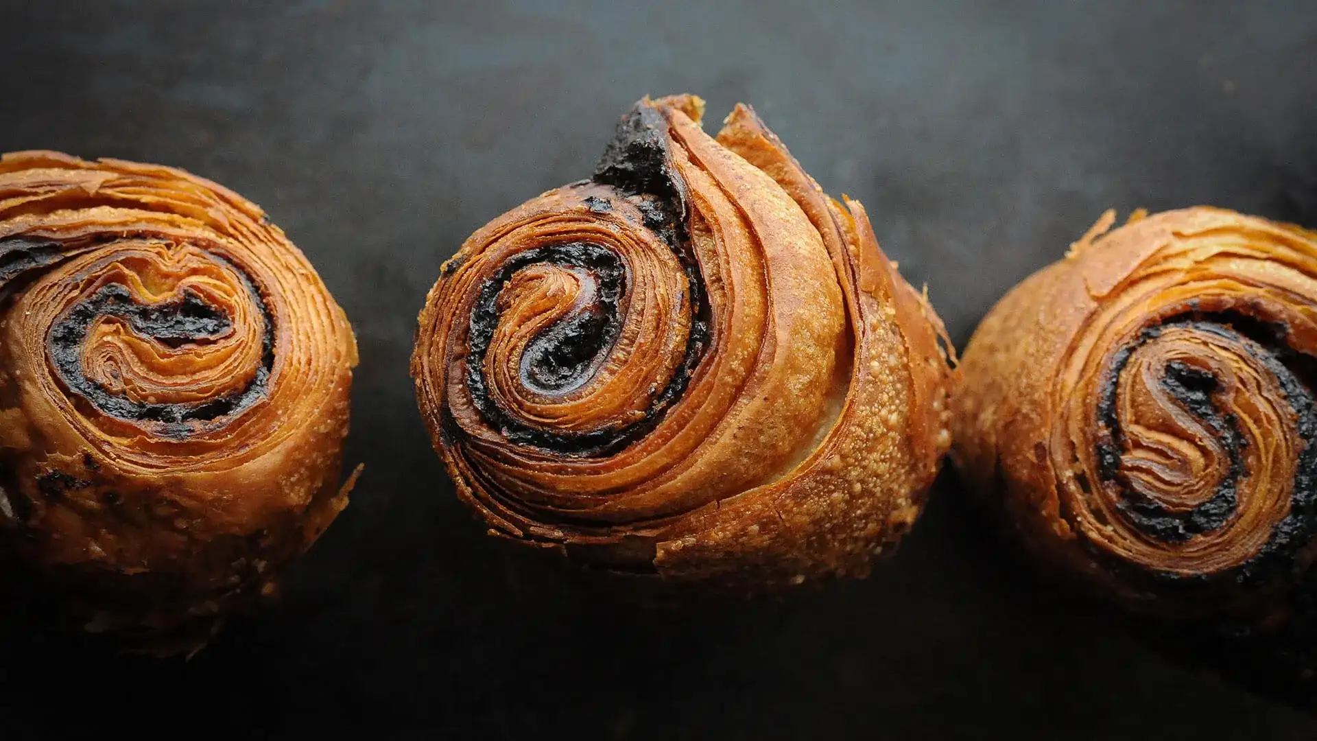 Three chocolate croissants.
