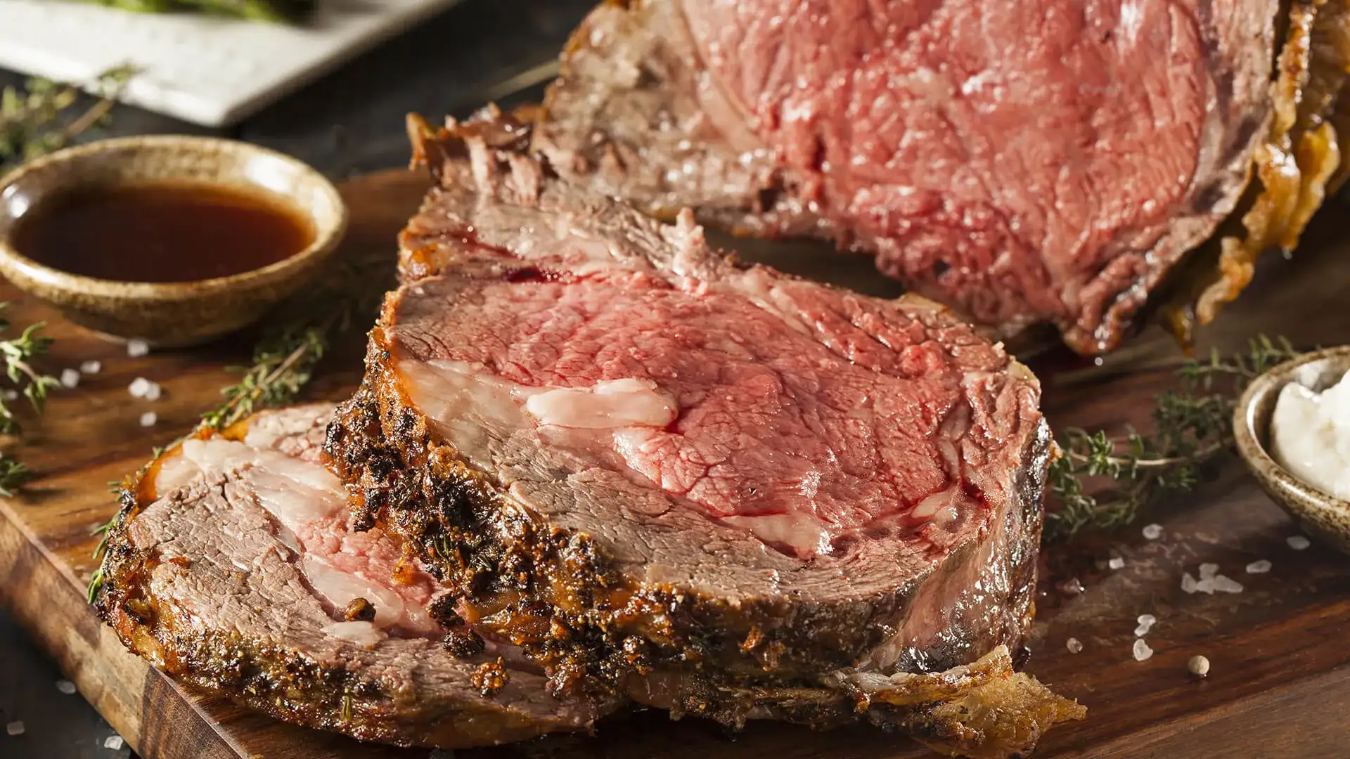 Prime rib sliced with a side of au jus.