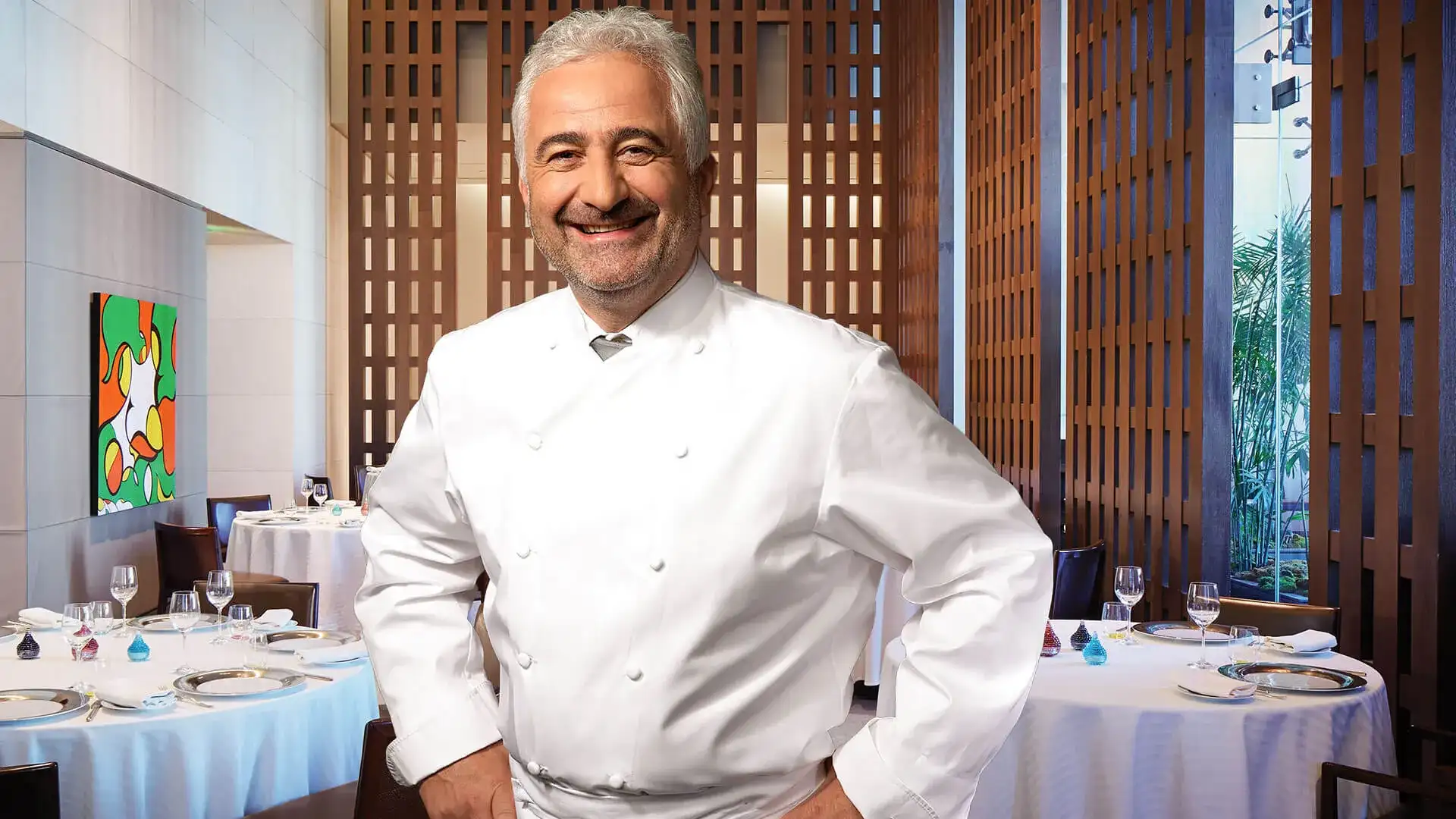 Chef Guy Savoy in the dining room of Guy Savoy restaurant.