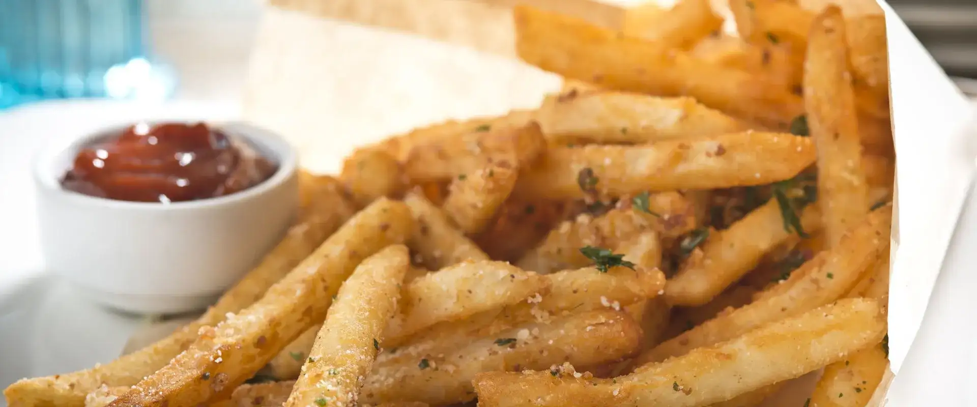 Duck fat french fries with a side of ketchup.