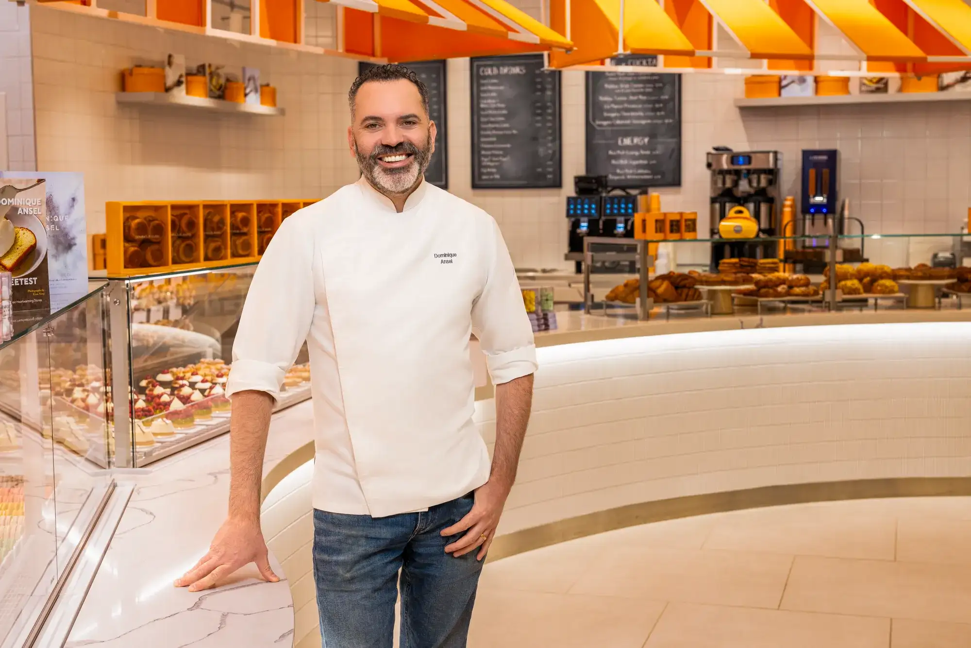 Dominique Ansel posing in front of Marche