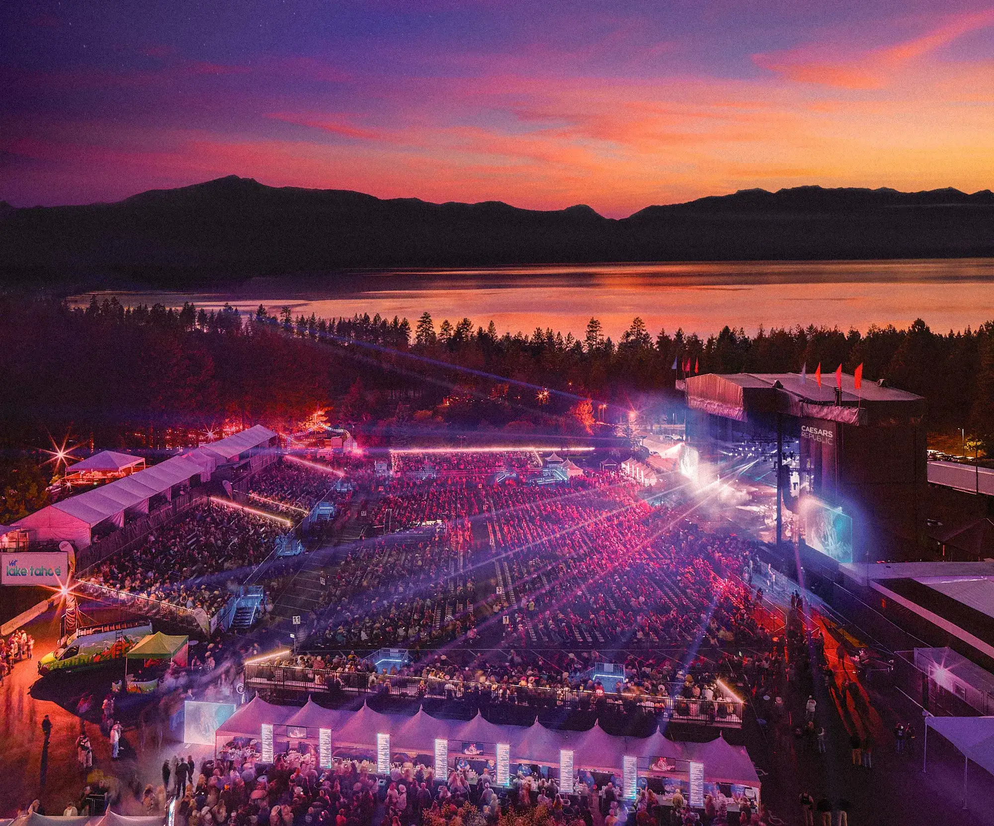 Lake Tahoe Outdoor Amphitheatre at Caesars Republic Lake Tahoe during a Summer Music Series concert at sunset, with a packed crowd, stage lights and the Sierra Nevada mountains silhouetted across the lake.