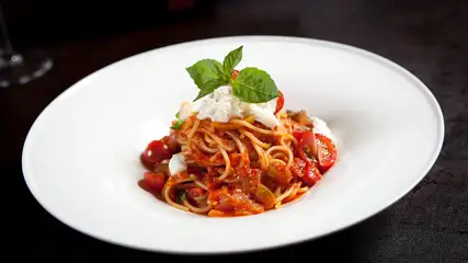 Spaghetti with tomato sauce, mozzarella, and basil.