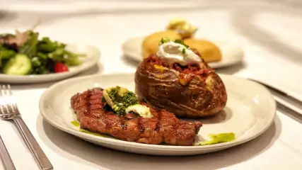 Steak, baked potato, and green salad.