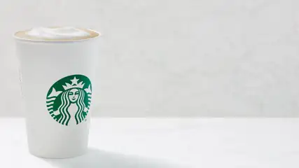 Starbucks beverage with foam top.