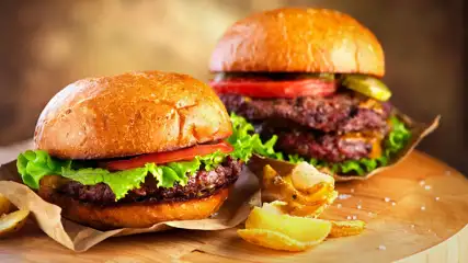 Two burgers side by side on a table