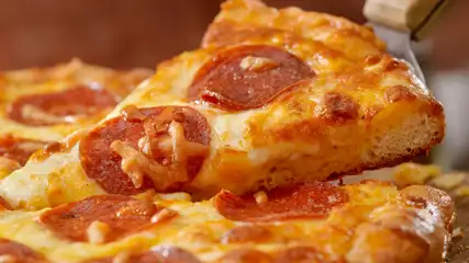 Pepperoni pizza slice.