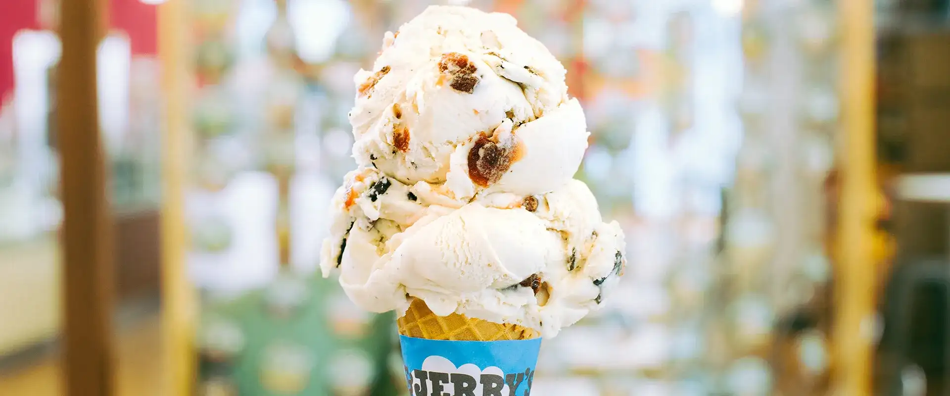 Ice cream cone with two scoops.