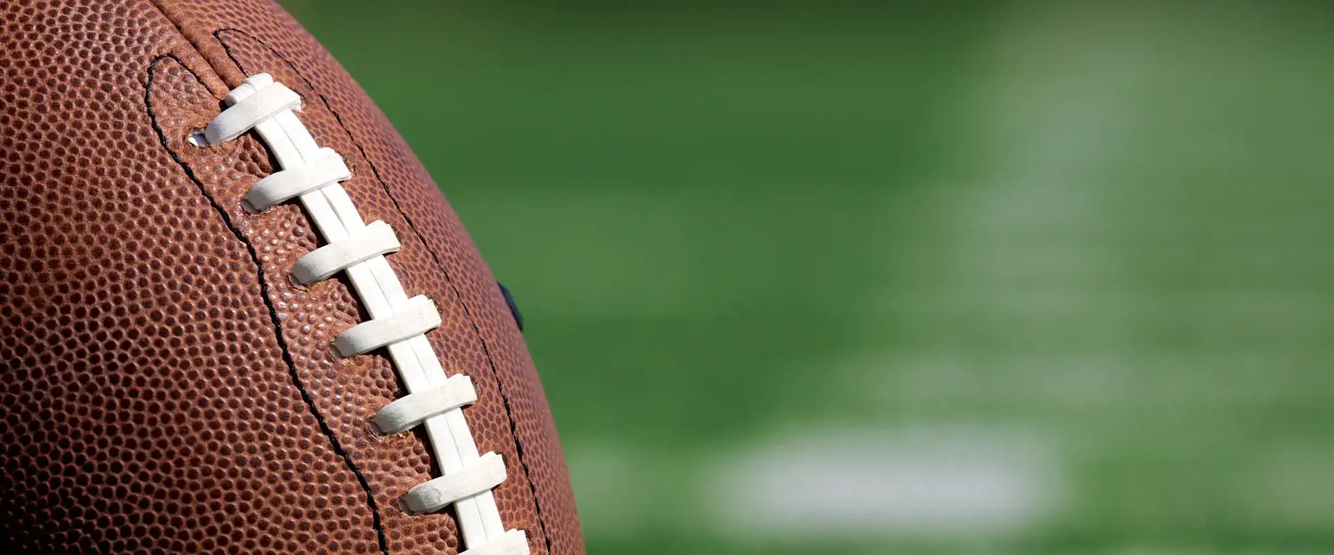 Football sitting on a football field