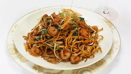 Plate of noodles with shrimp.