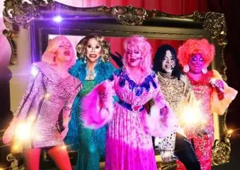 Image of a group of Drag Queens in colorful attire and impersonating celebrity divas