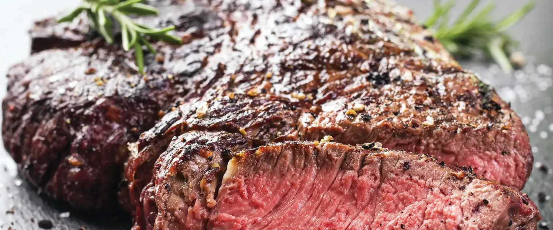 Medium cooked steak with rosemary
