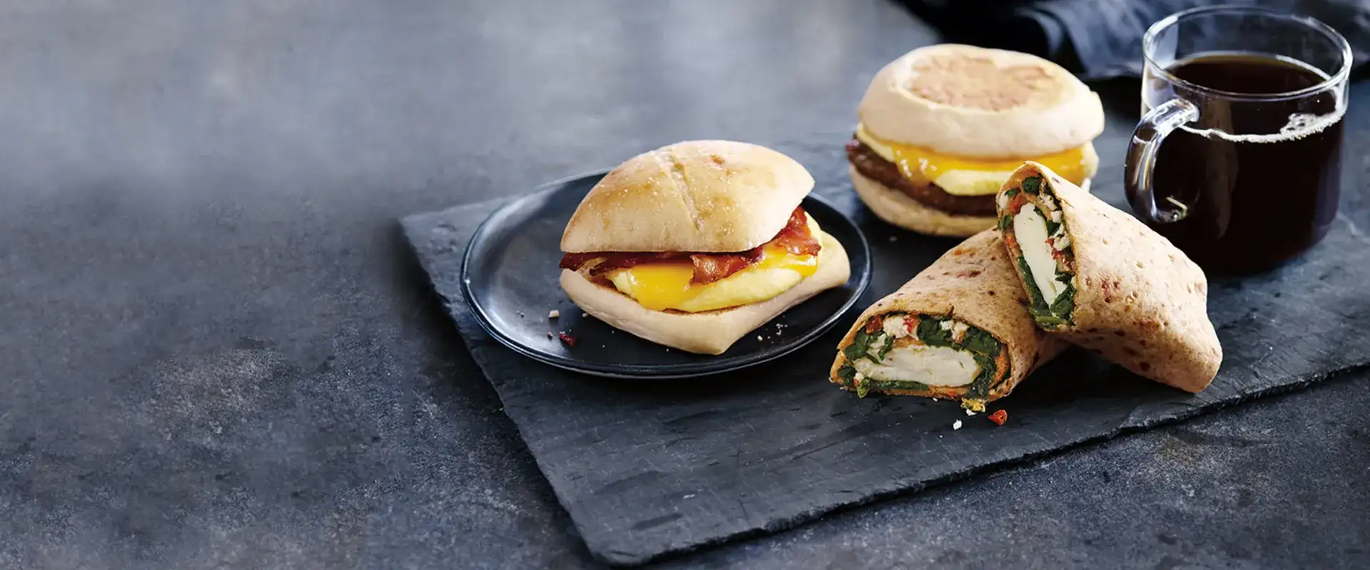 Quick bites on a plate with a cup of coffee.
