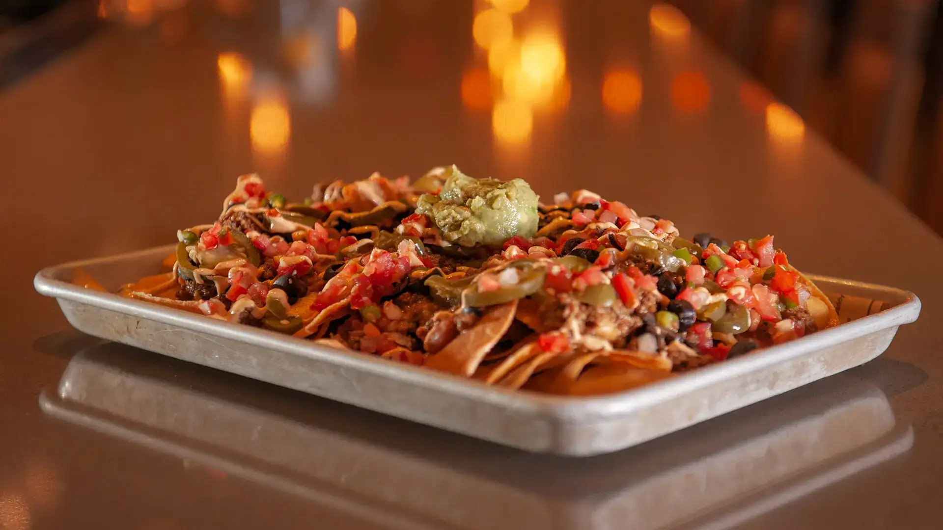 Platter of nachos with all the fixings at Brew Brothers.