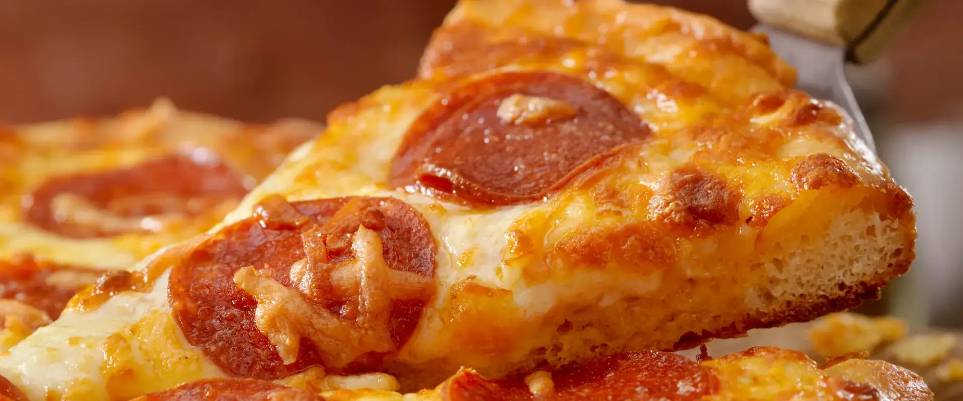 Pepperoni pizza slice.