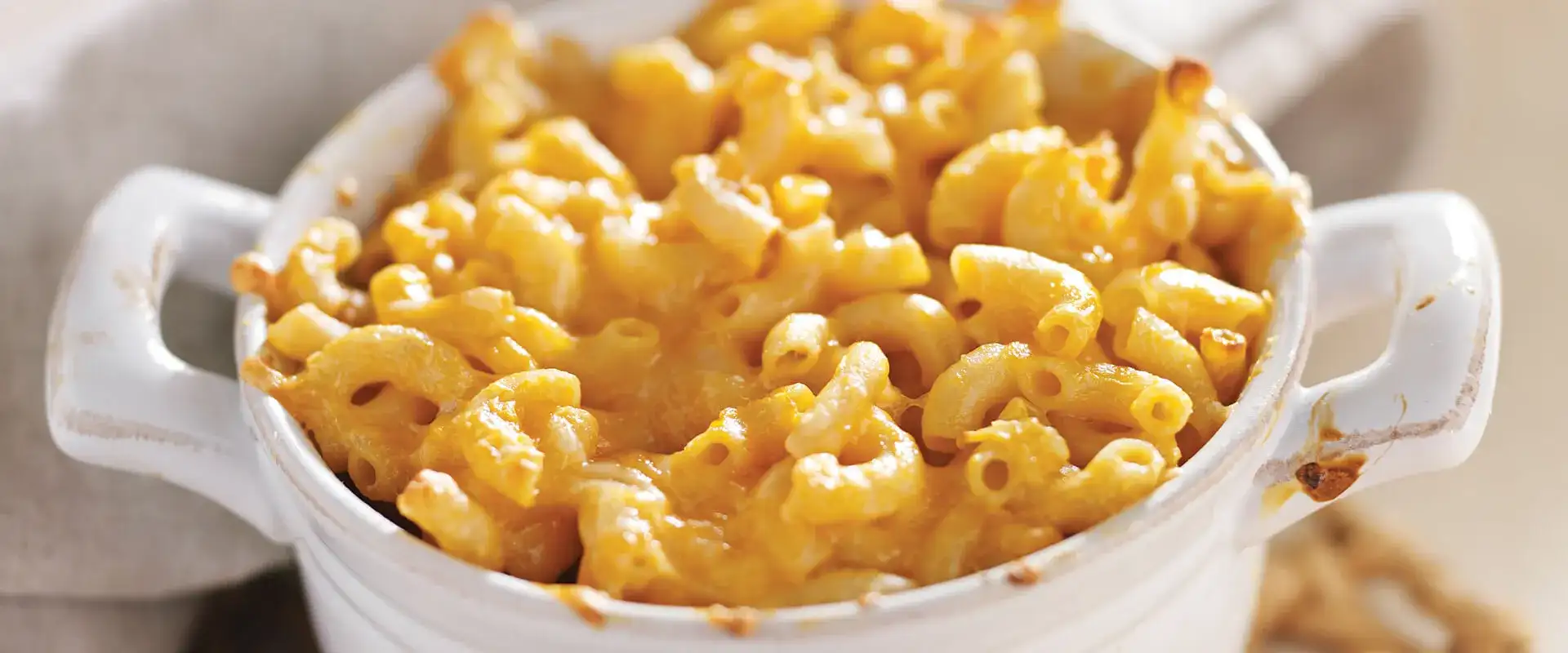 Dish filled with macaroni and cheese.