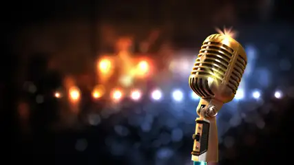 Microphone glimmering with lights in the background.