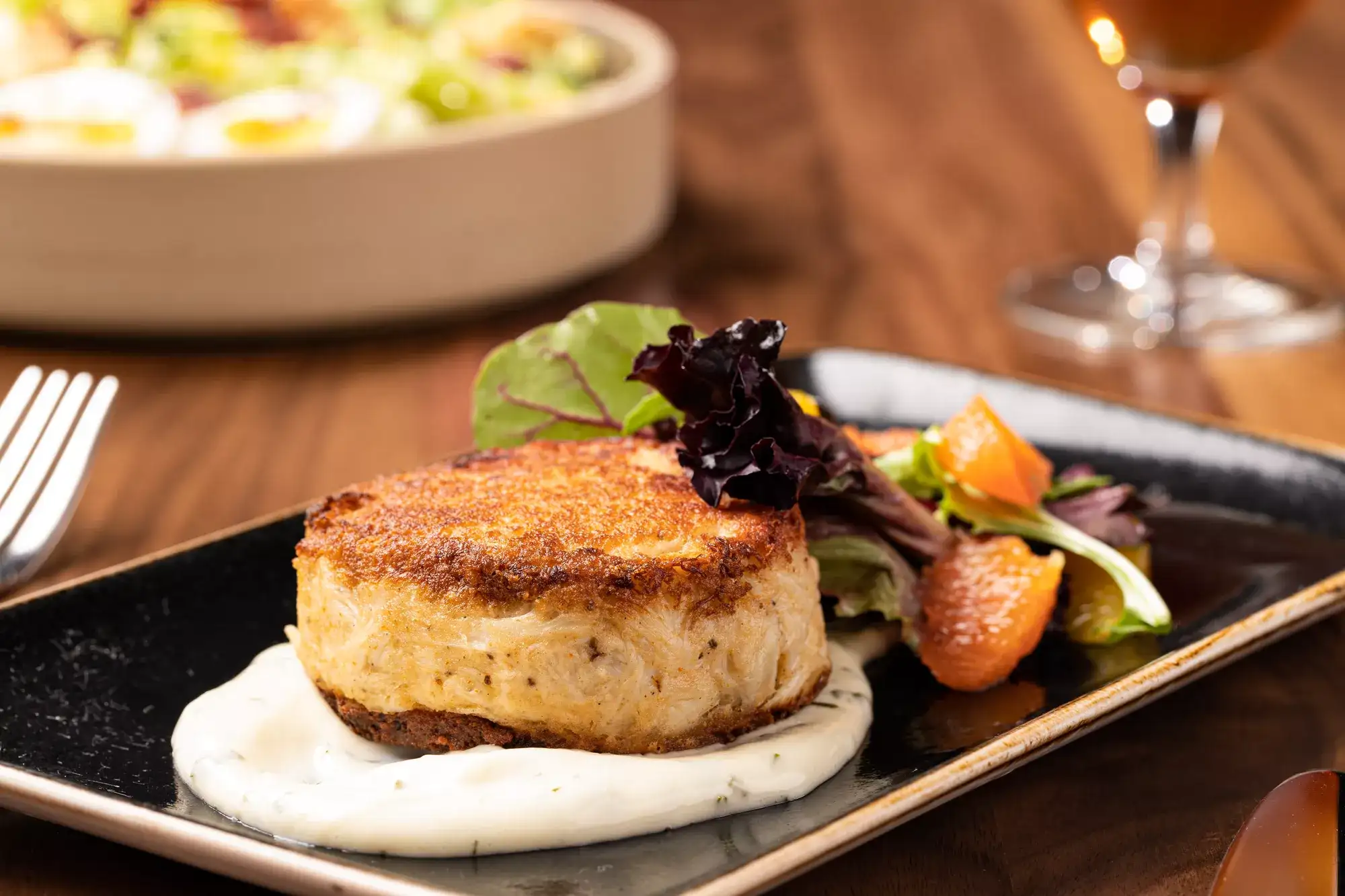 Crab cake plated and garnished