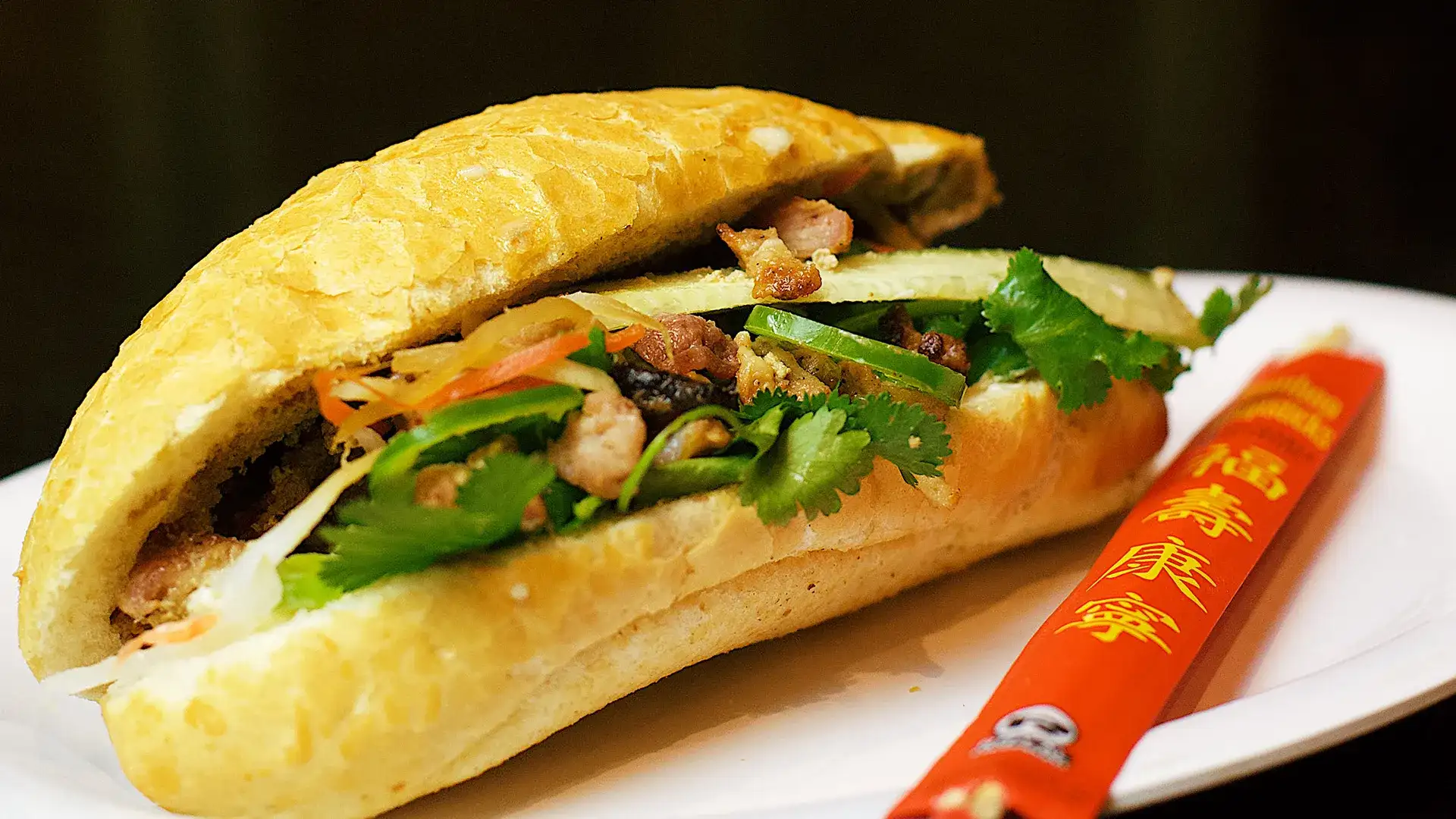 Banh mi and chopsticks on a plate.