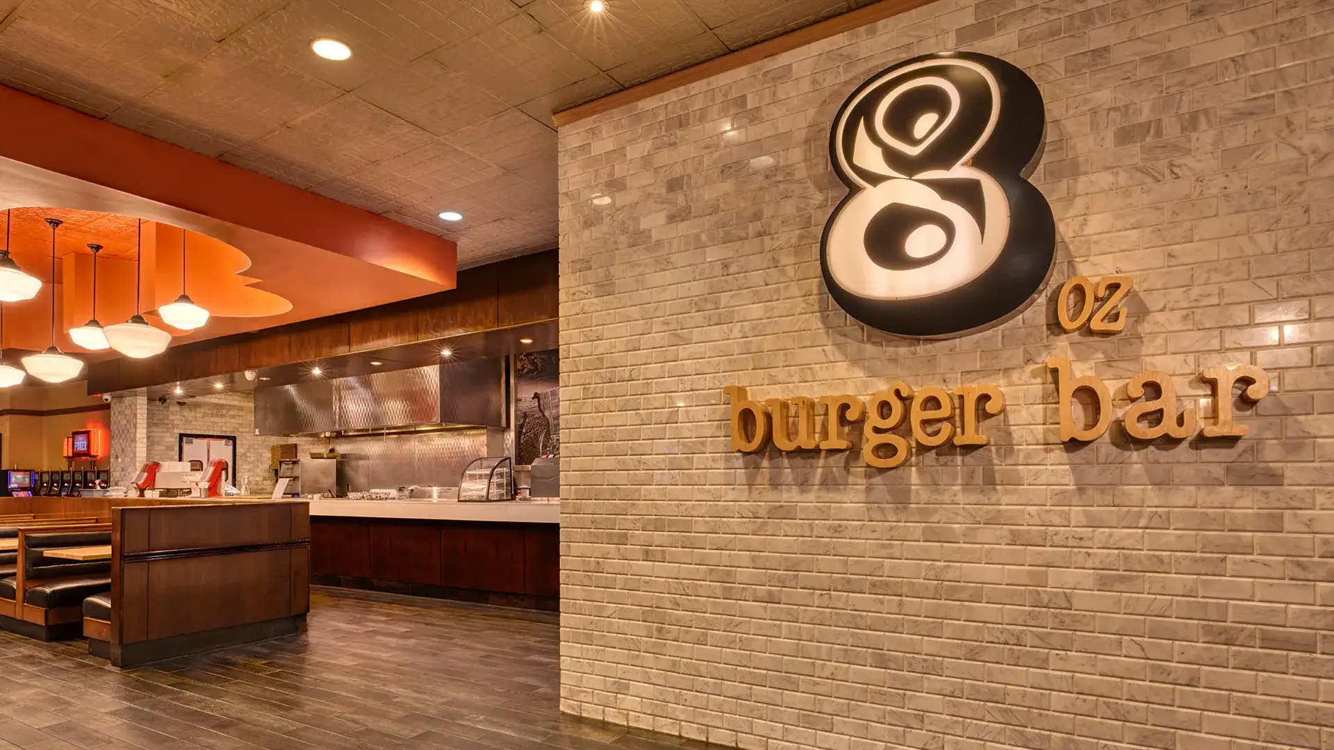 8 Oz. Burger Bar sign at entrance and seating area.