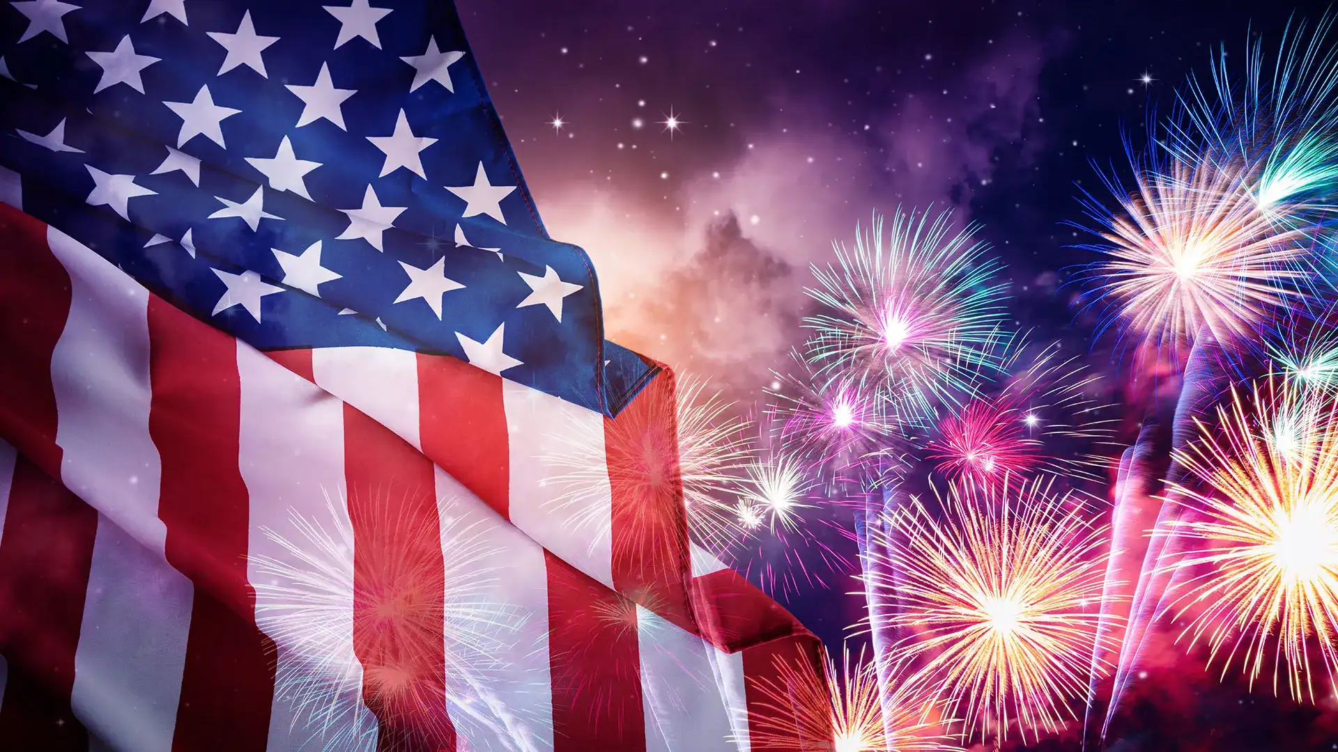 The American flag and fireworks at night
