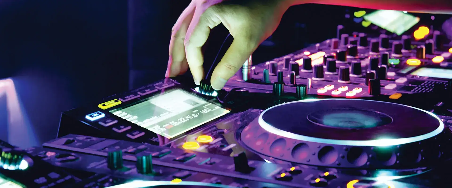 DJ adjusting nob on turn table.