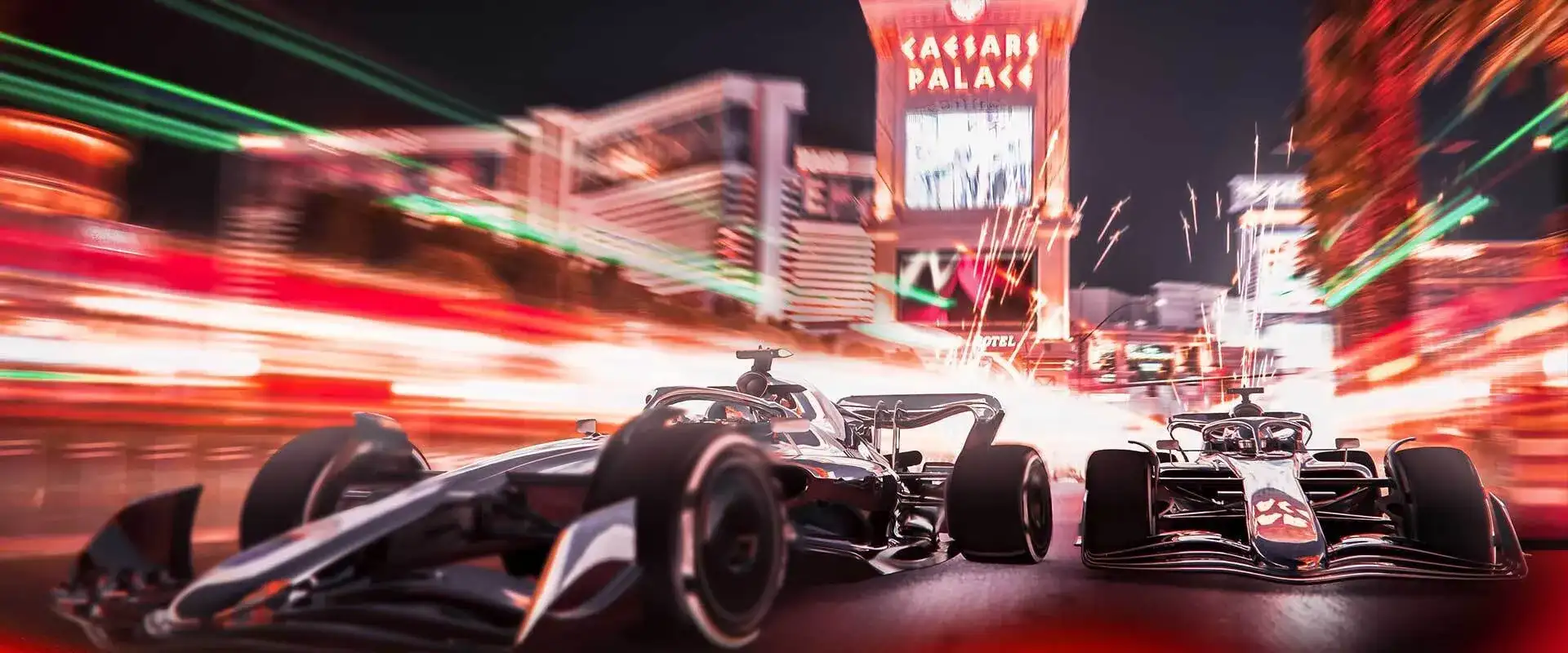 Two Formula 1 race cars racing down the Las Vegas strip past Caesars Palace marquee