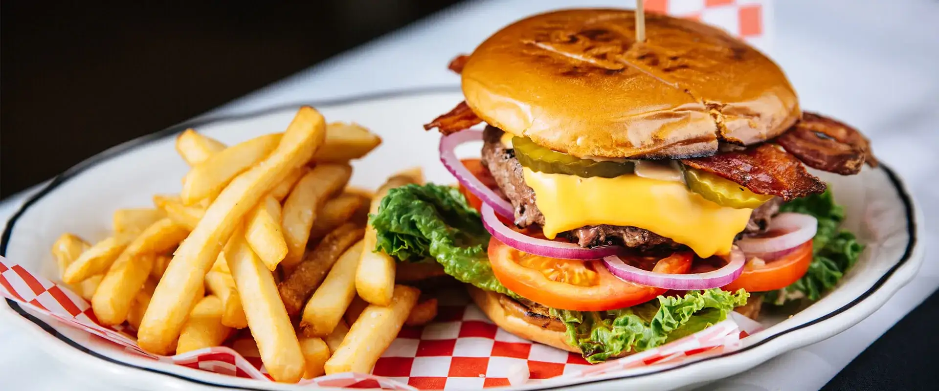 Hamburger with a side of fries.