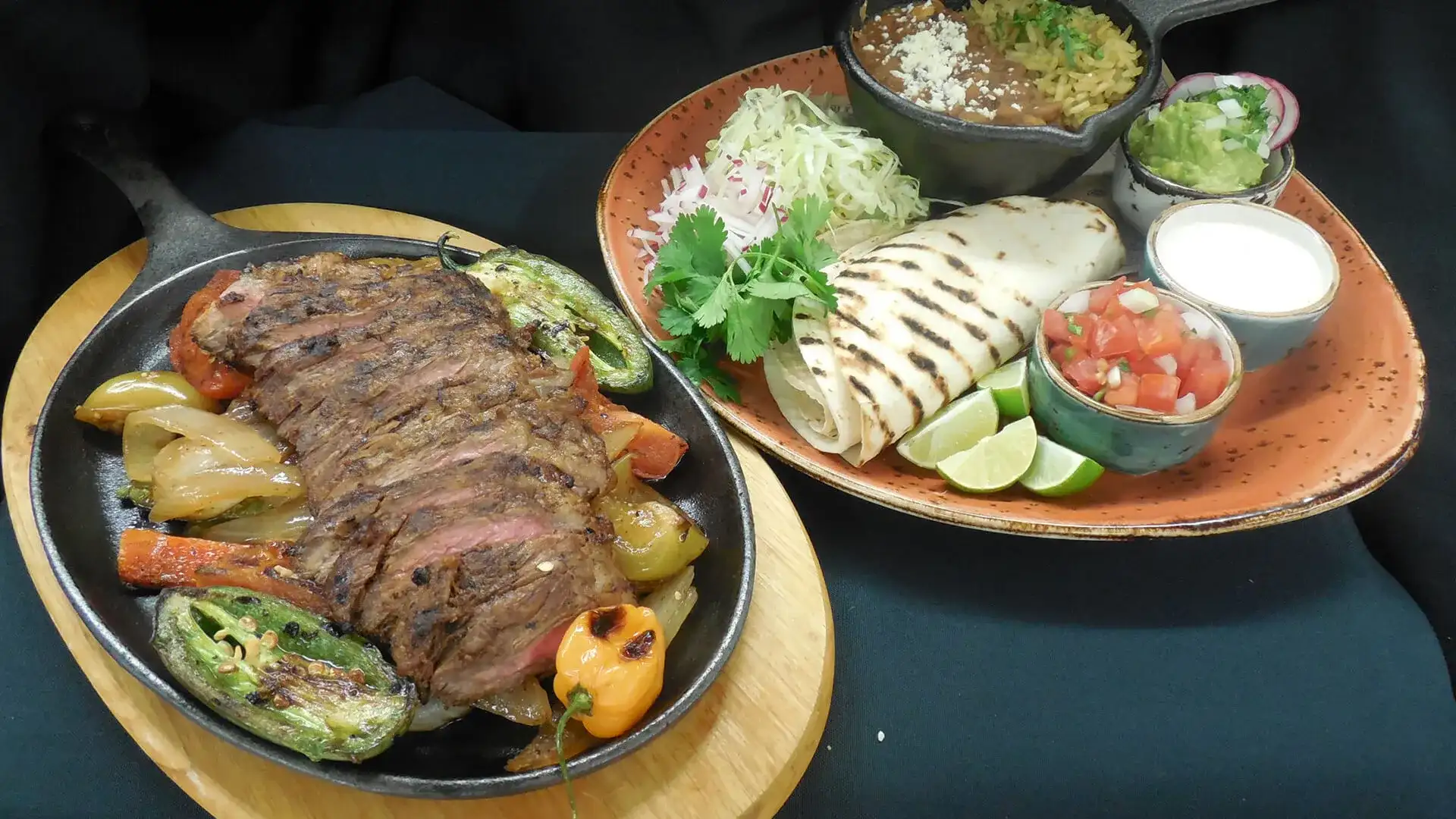 Carne Asada with roasted peppers, fresh tortillas and toppings.