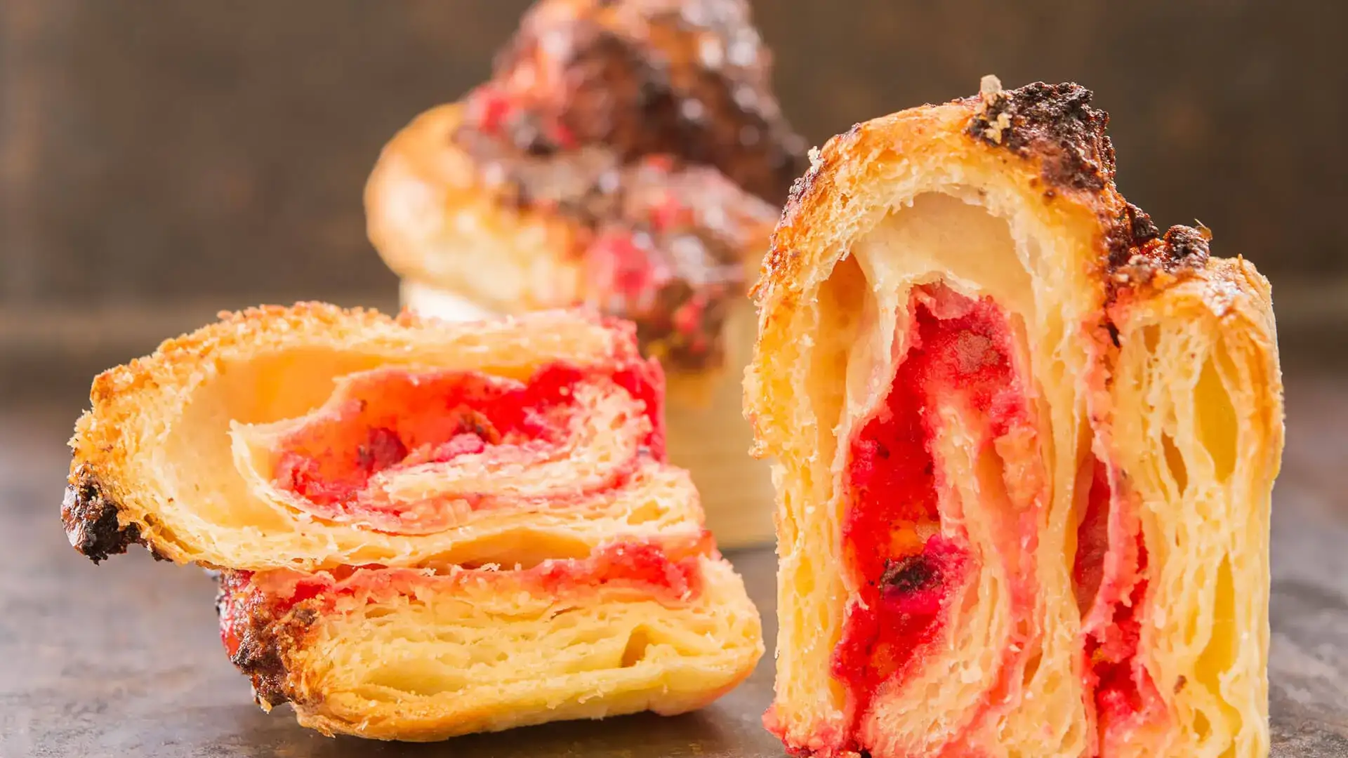 Brioche pastry cross-section with fruity filling.