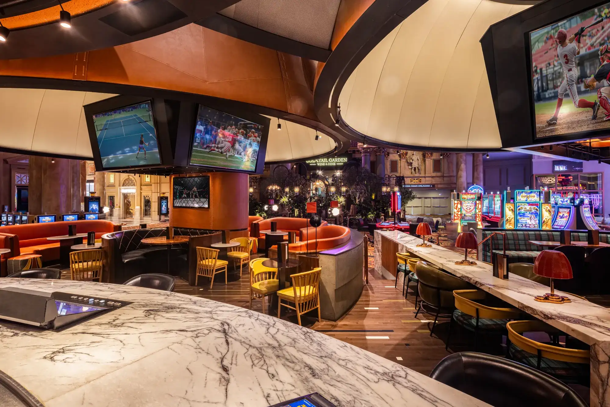 Stadia Bar at Caesars Palace with lounge seating and large TVs showing sports