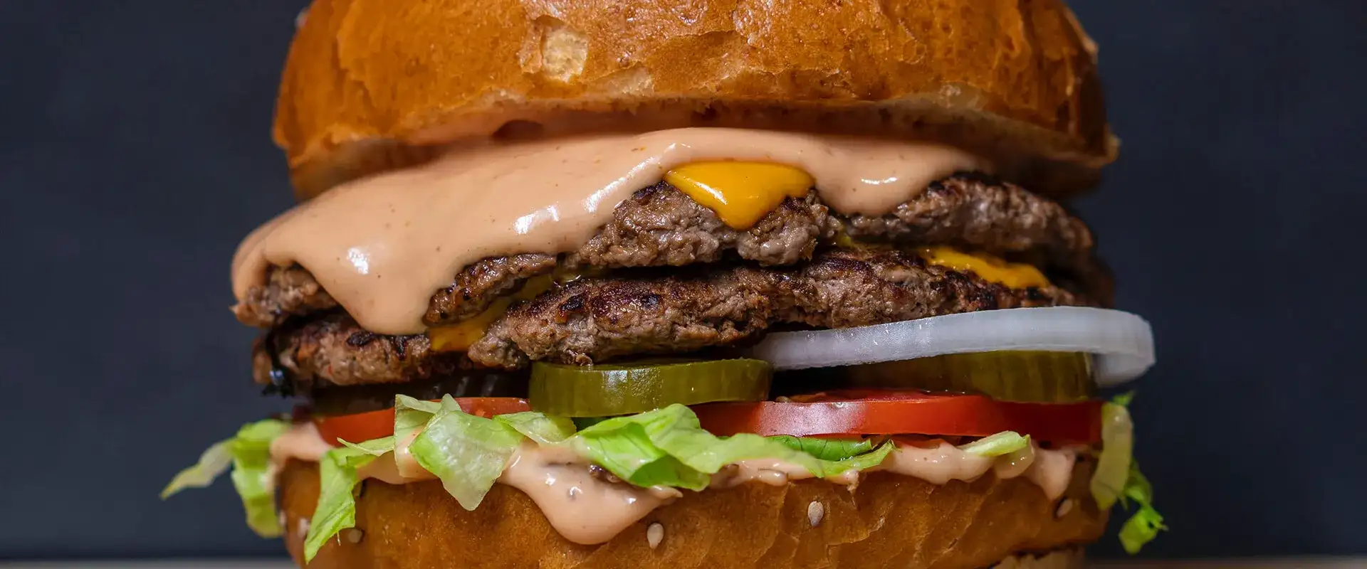 Cheeseburger with all the trimmings and a sesame bun.