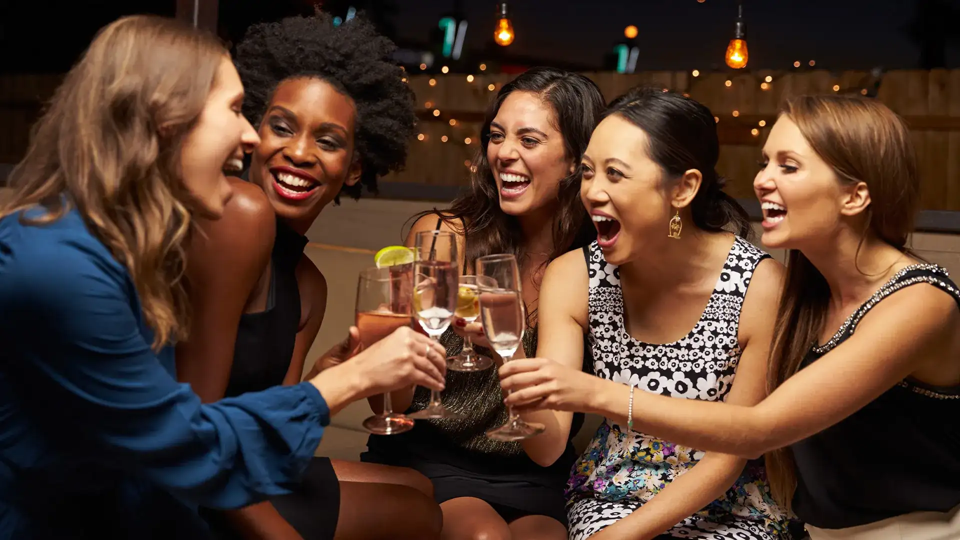 Group of women toasting drinks