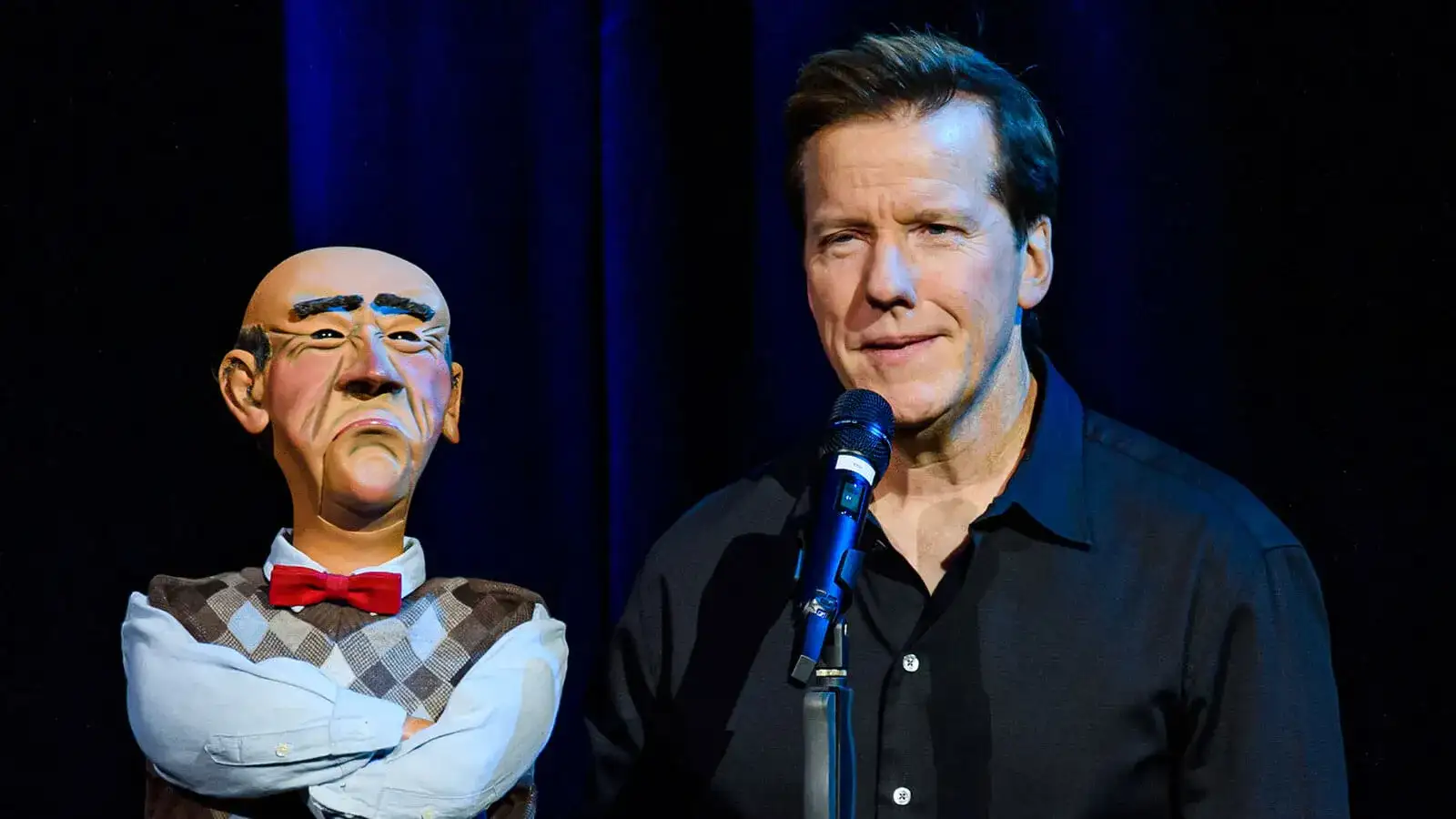 Closeup of Jeff Dunham and the old curmudgeon puppet named, "Walter" performing live