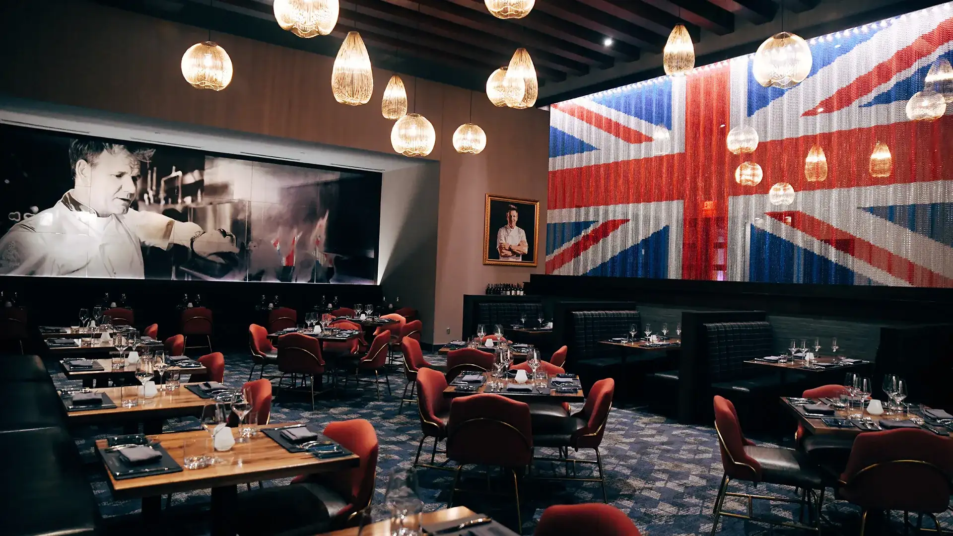 Tables and banquettes in the dining room at Gordon Ramsay Steak.